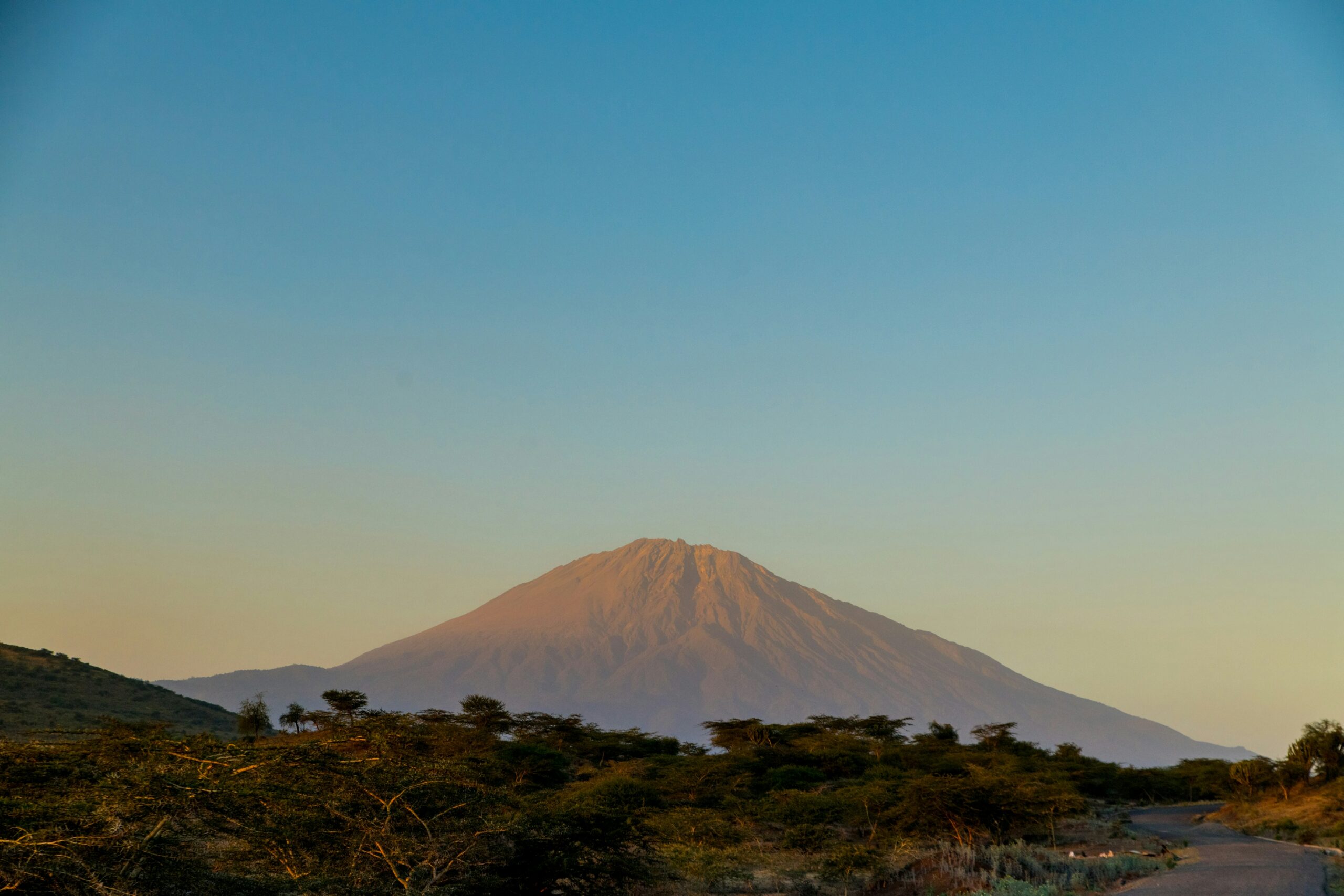 Mount Meru at sunset in Arusha National Park, Tanzania